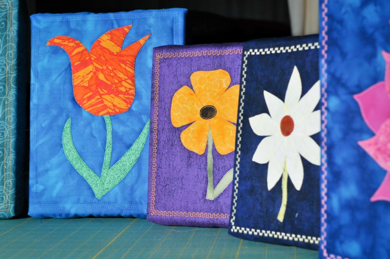 A series of framed mini quilts