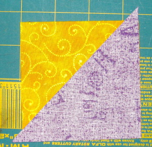 Line up purple triangle and yellow square at right angle corners.