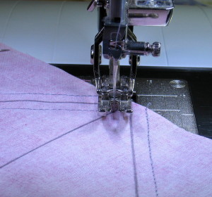 Lift foot, pivot and continue sewing.
