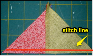 Lay triangle on cutting mat with stitching line closest to you.