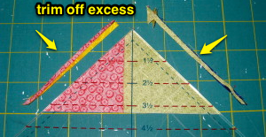 Trim off excess fabric on both sides of ruler.