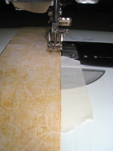 Place a piece of masking tape along the machine where there quarter inch mark is.