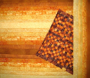 A large strip set with a small strip set that has been sewn in strips twice.