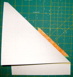 Fold paper back over template plastic.