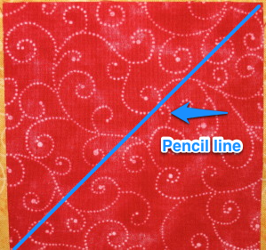 Draw a pencil or chalk line from corner to corner.