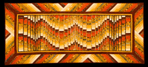 Warm colours make up the colours in this Autumn Bargello Quilt