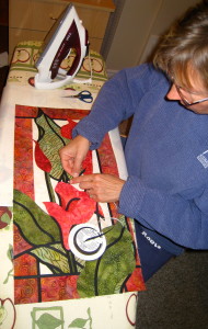 Placing a piece of bias tape in position.