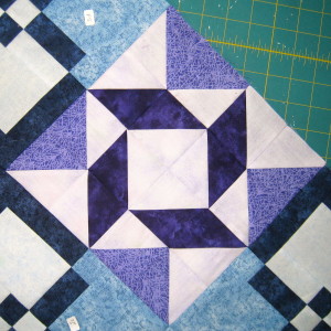 Adding in a medium value gives the block balance between the three fabrics and creates a block that is no longer boring.