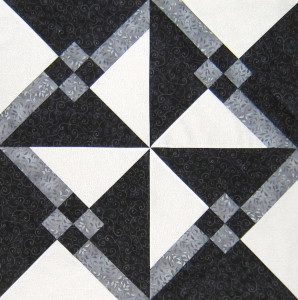 The white, grey and black create contrast within the block with secondary designs emerging.