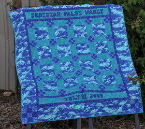 Even thought he dolphins are lighter there is little to no contrast in the quilt seeing how mostly medium valued fabrics were used.  