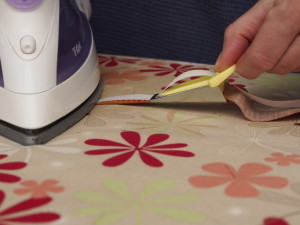 Press fusible in place on fabric with a dry iron