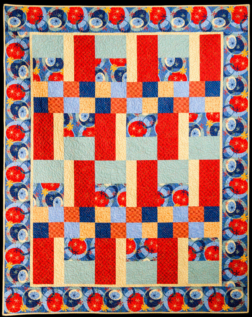 Red is the focal point of this children's quilt