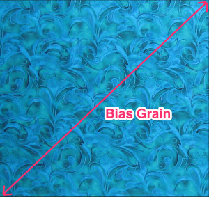 Diagonal bias line across a square of fabric