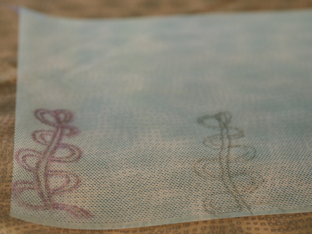 One motif traced in pencil and another motif that has already been used with the marking pen