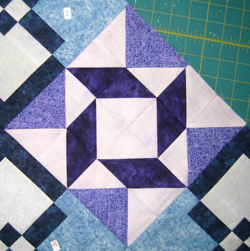 Purple block with the medium value fabric - what a difference
