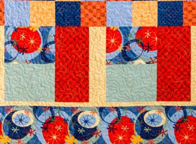 A beginner patchwork quilt with free motion stars