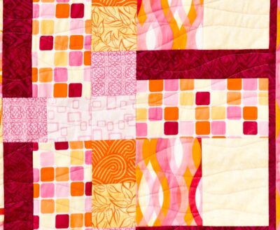 A beginner patchwork quilt with rectangles and squares