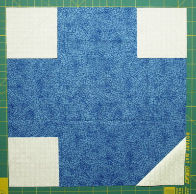 Sew the small squares into the other corners 