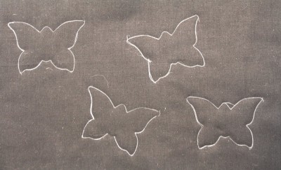butterfly design traced on the fabric