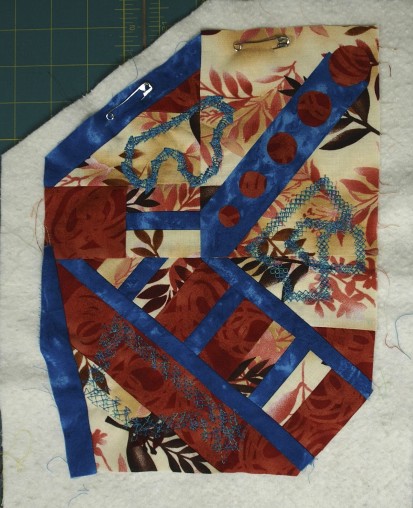 a little art quilt with decorative stitching 