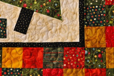 Christmas wall hanging with close up of quilting