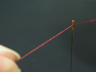 Needle threaded
