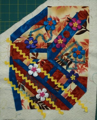 little art quilt with flowers and button embellishments