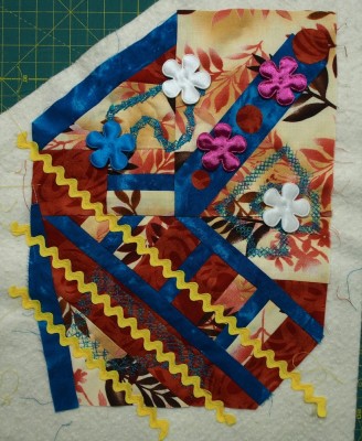 little art quilt with fabric flowers added