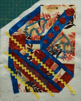 little art quilt with yellow rickrack added