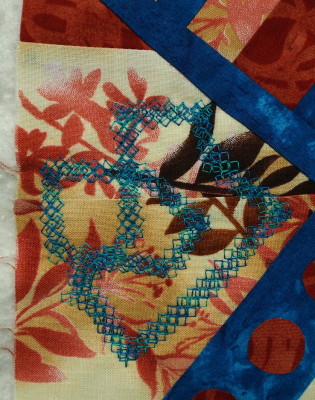 little art quilt with third decorative stitch done