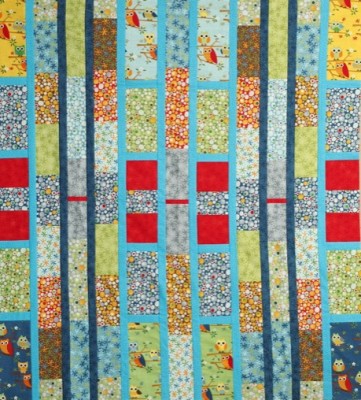 multi coloured strip quilt