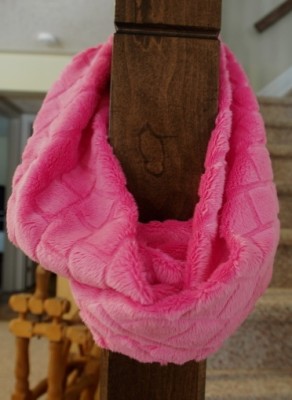Pink scarf wrapped around twice on post