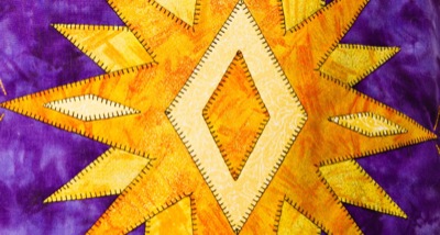 yellow and gold star with blanket stitch