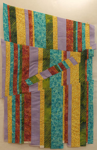 Vertical and diagonal stripes of multi coloured fabrics