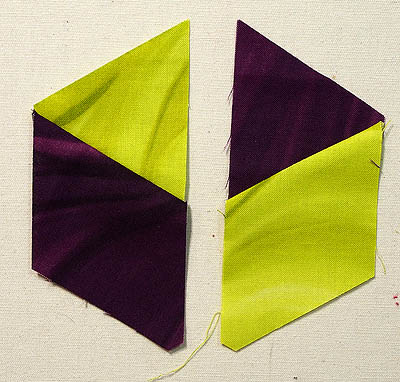 Lime and magenta triangles and diamonds sewn together