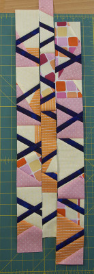 3 strips of multi-coloured fabrics in differing widths