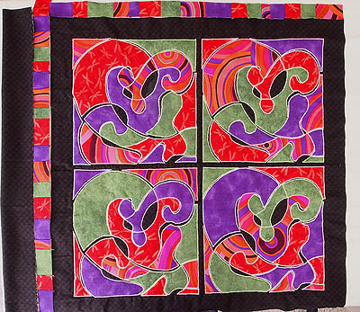 Auditioning the pieced borders on two sides of the quilt