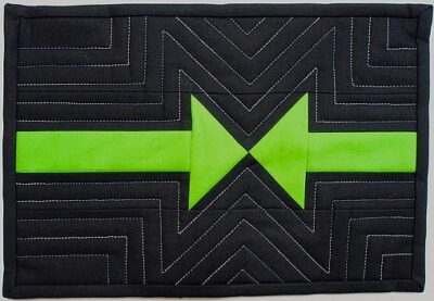 Follow the Arrow mug rug in black and green