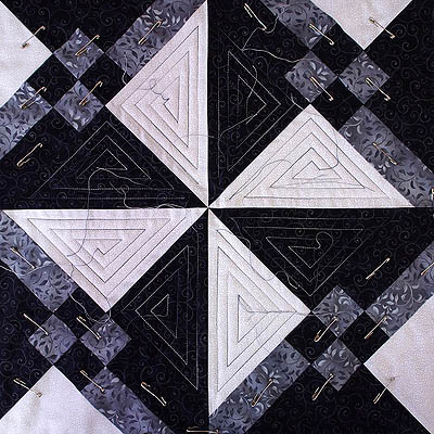 Spiral quilting motif used for the centre pinwheel design