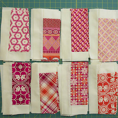 Two rows of orange, pink and cream pieces