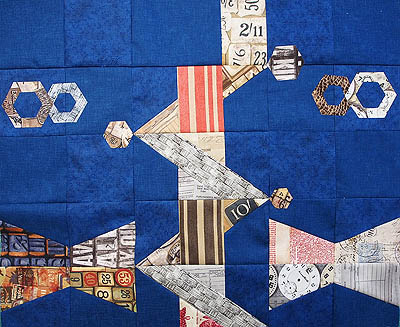 Eclectic elements fabric on a blue fabric background