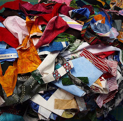 A mound of scrap fabric in every colour