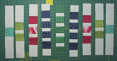 Rows completed by adding more background fabric to top and bottom