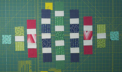 Background fabric sewn between the pre-cut squares