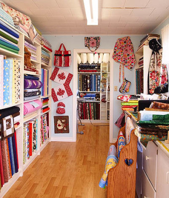 Shelves of fabric and quilts