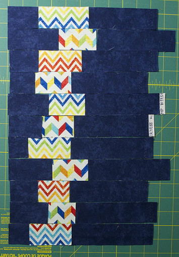 Blue fabric and white fabric with zigzags in multi colours