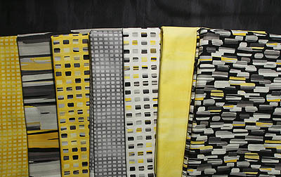 Multiple fabrics in grey, black & yellow