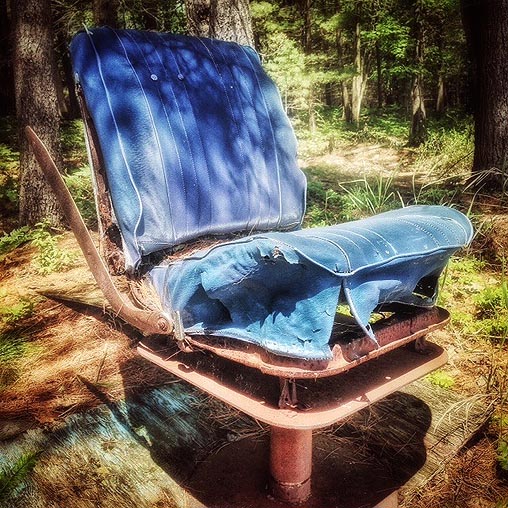 Blue chair on the lakeshore
