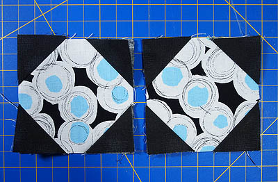snowball blocks made from black, white and teal fabrics