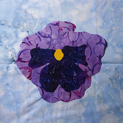 Purple flower on blue background